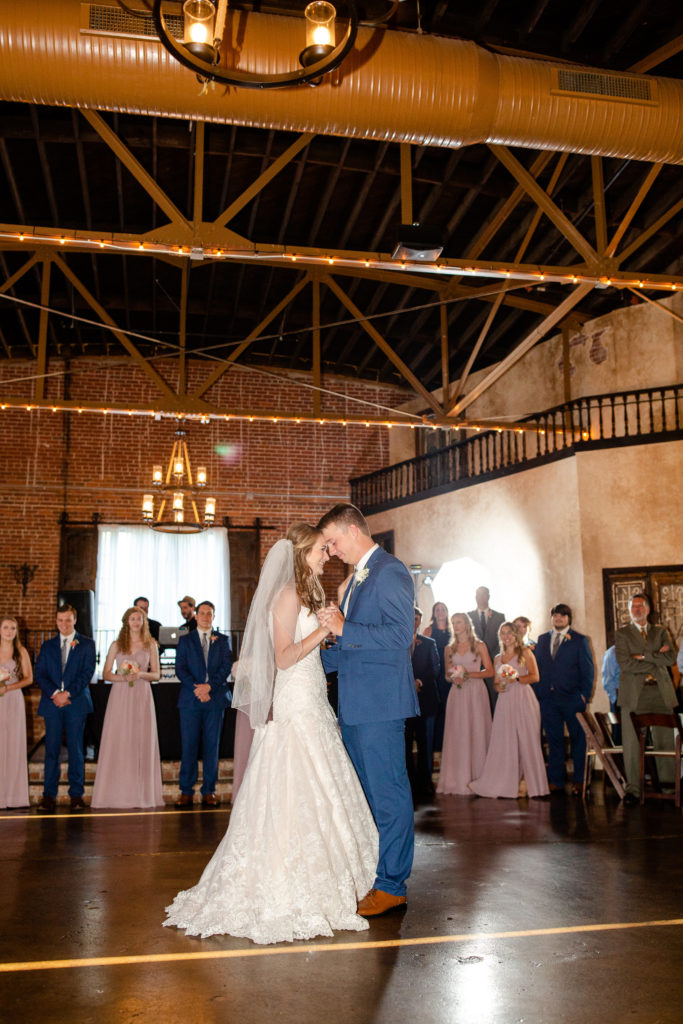 Couple sharing first dance with foreheads touching