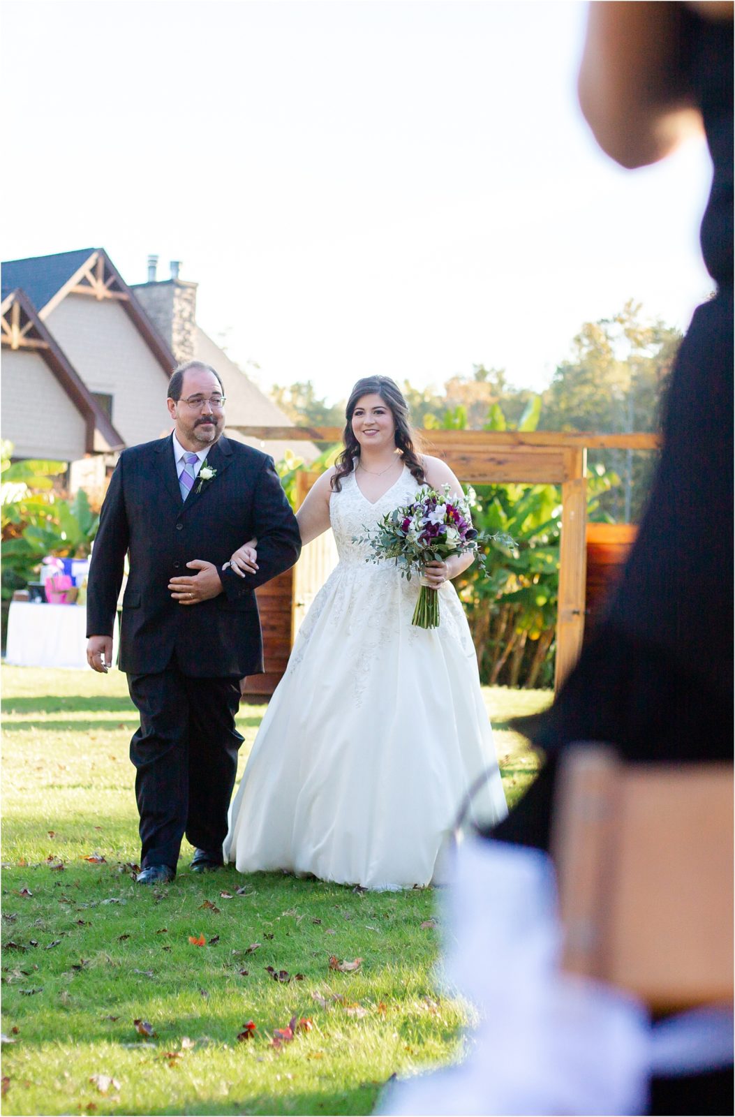 Bride walking with dad in SC mountain wedding