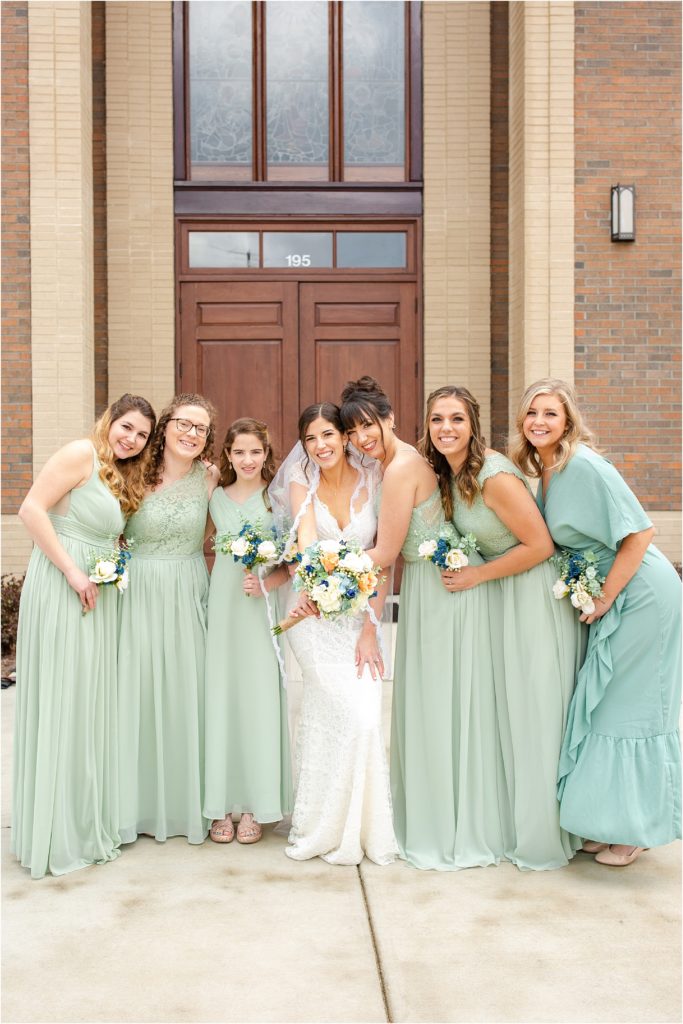 Bride and friends pose for wedding portraits