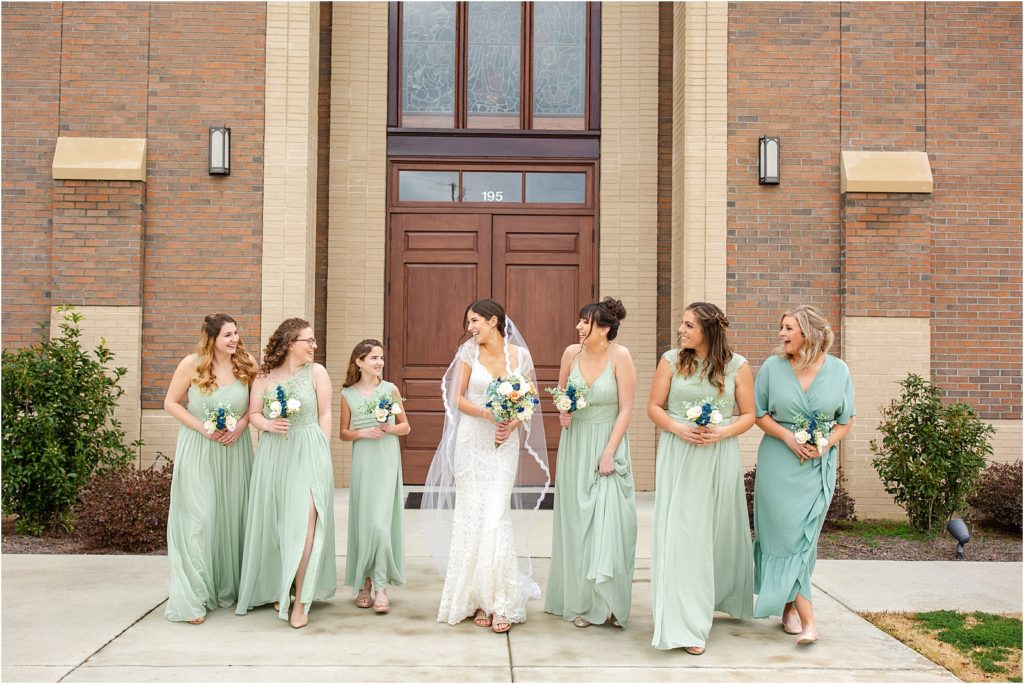 Bride and bridesmaids walk together before Chapin wedding