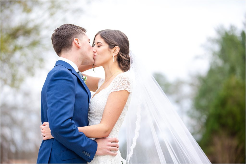 Wedding couple kissing for wedding photographers