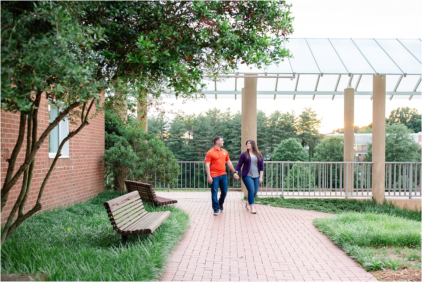 engaged couple wearing clemson colors for photo session