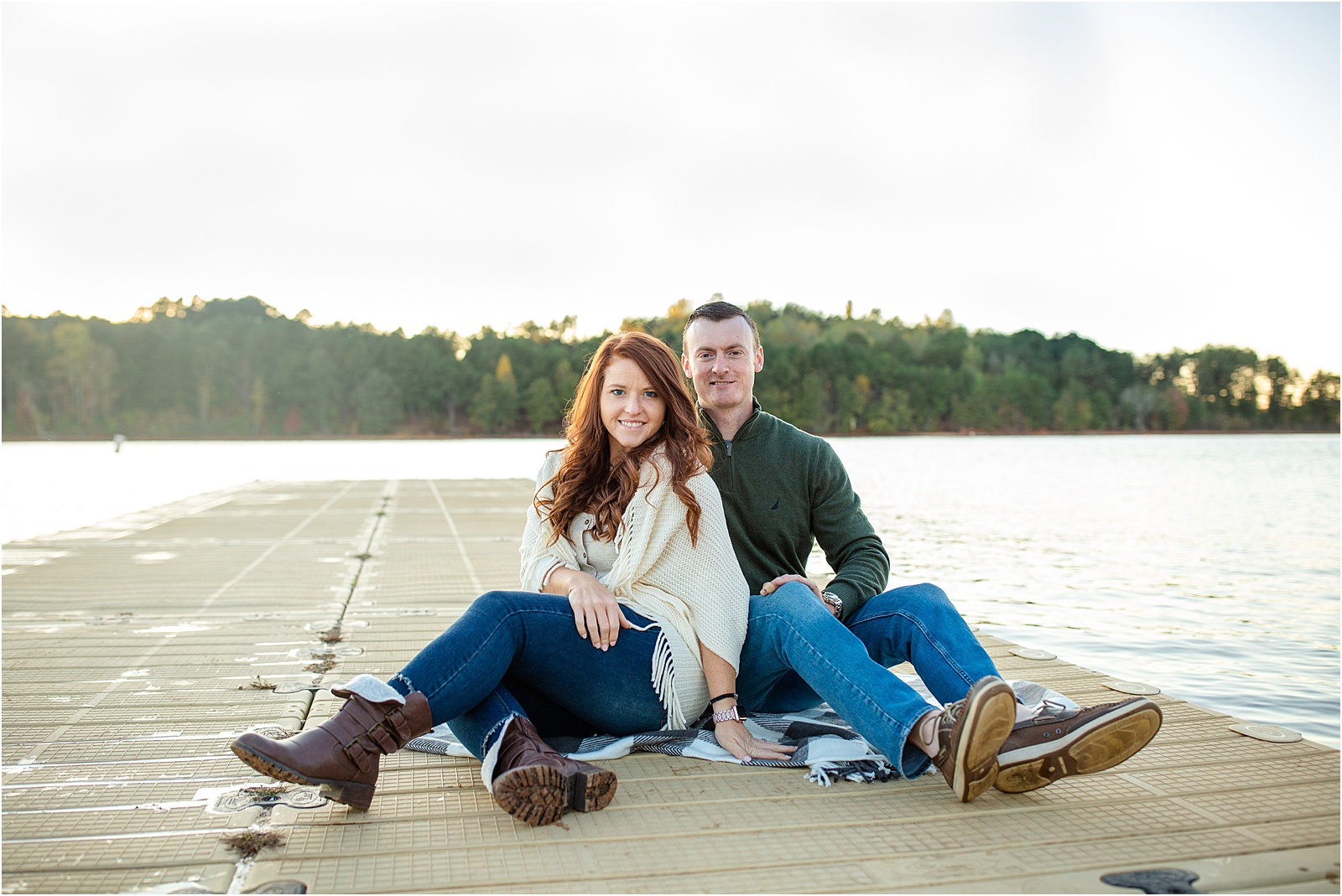 couple sitting on blanket on Clemson dock