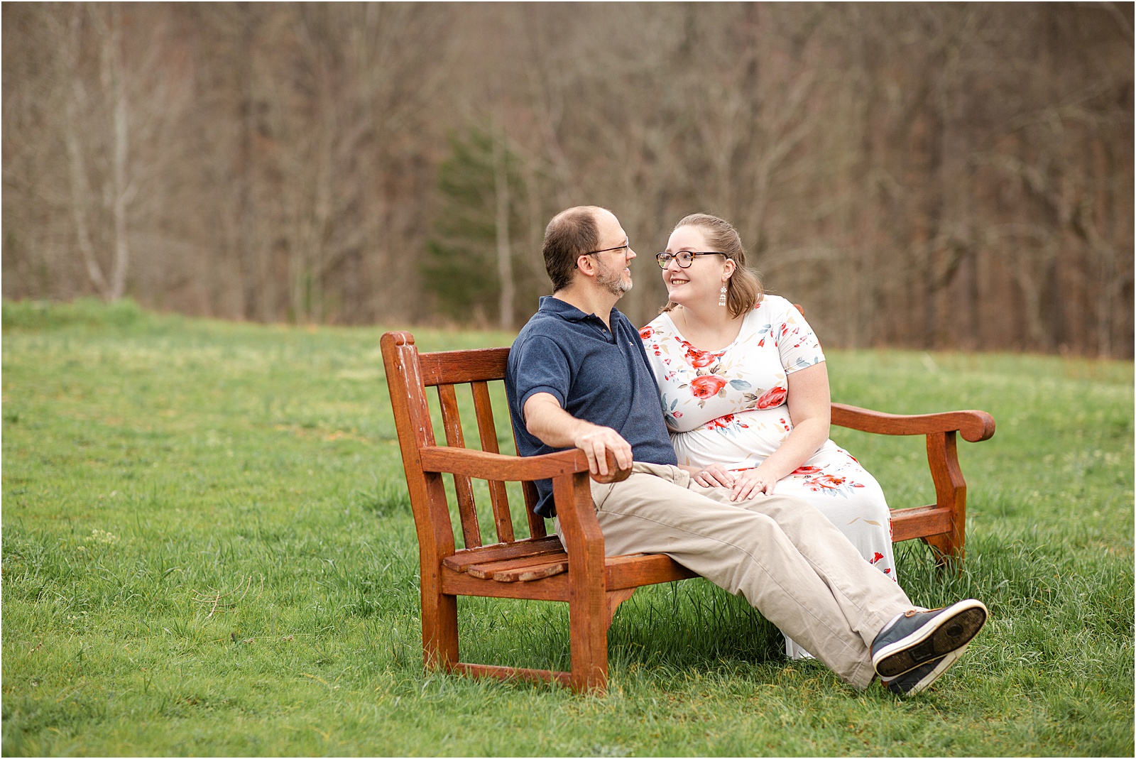 clemson engaged couple on wooden bench