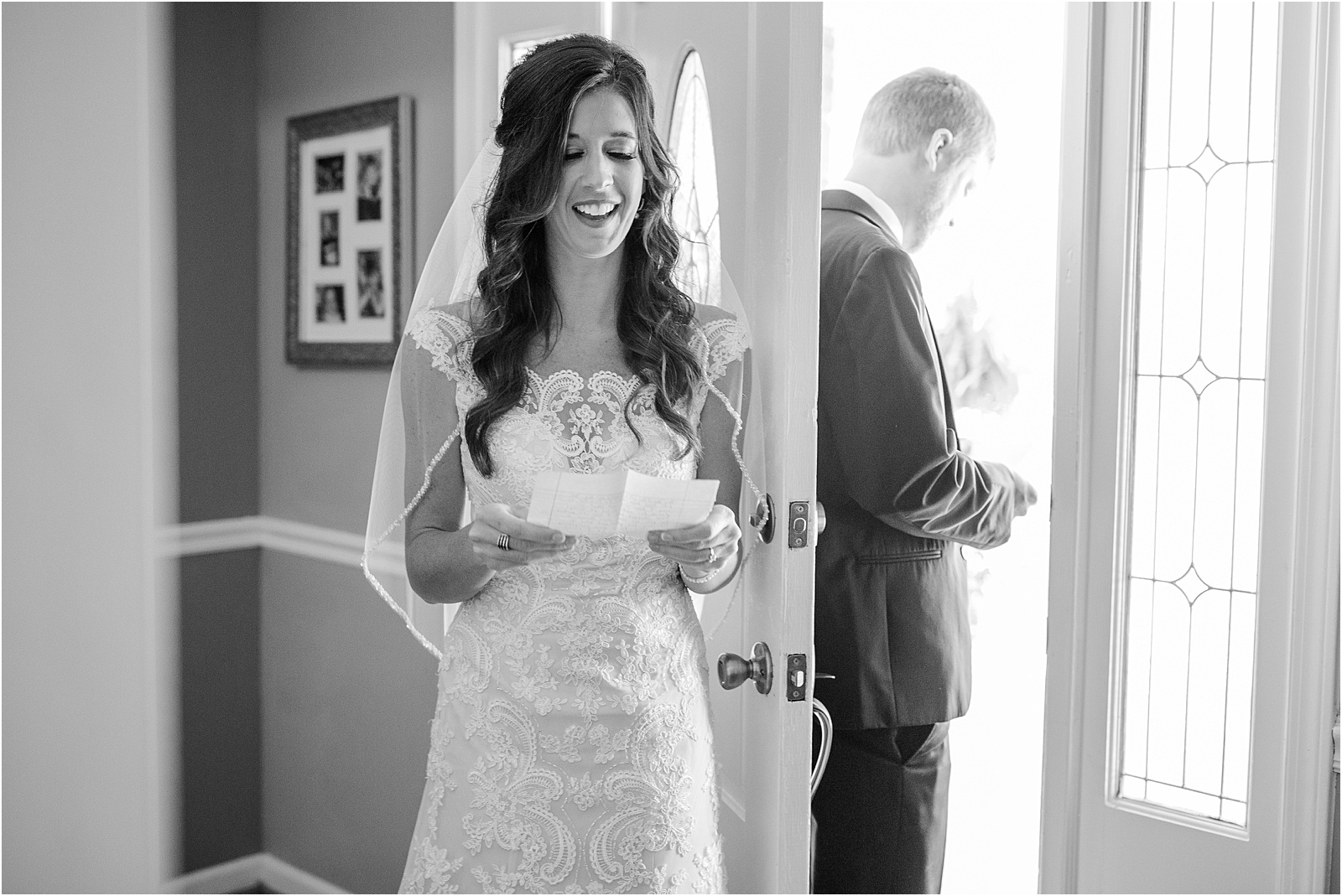 bride laughs while reading letter from groom