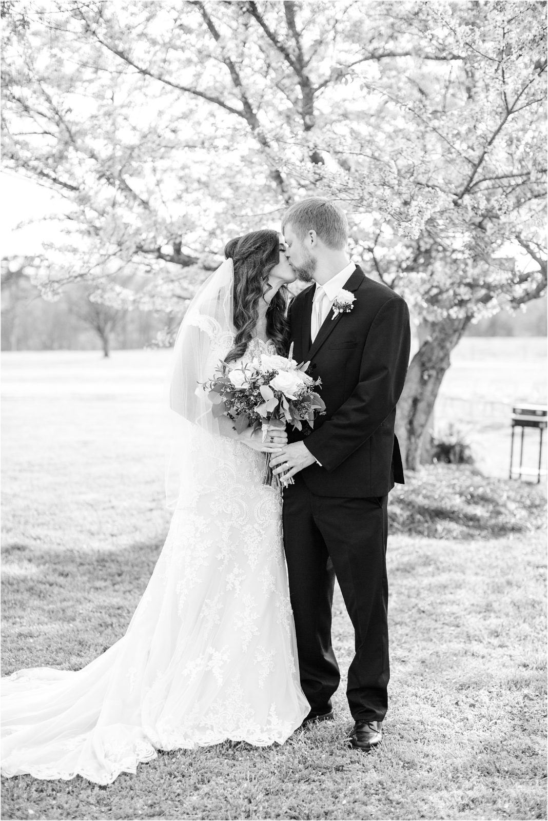 couple kiss for wedding photographer