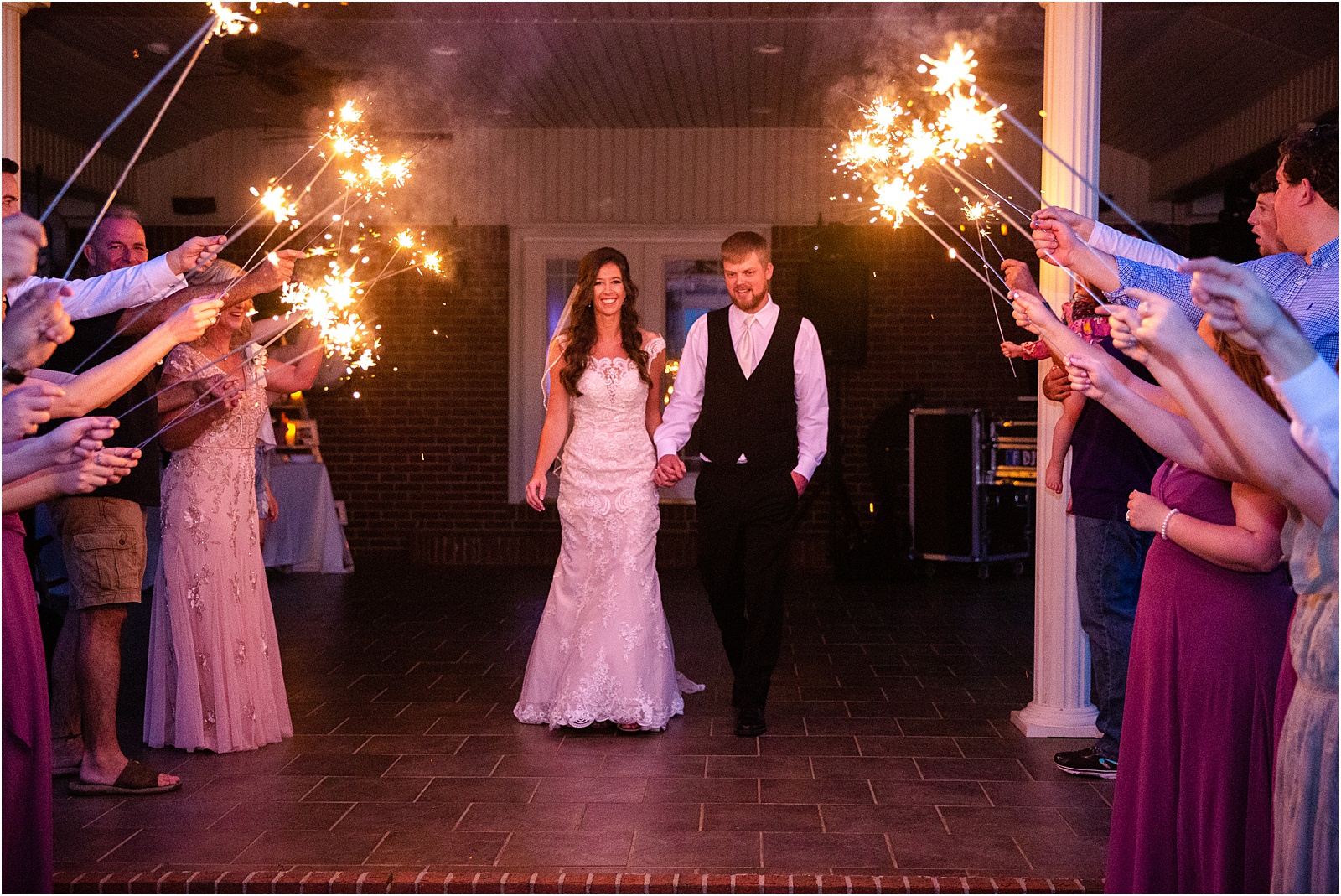 Hartwell GA couple leaving wedding under sparklers