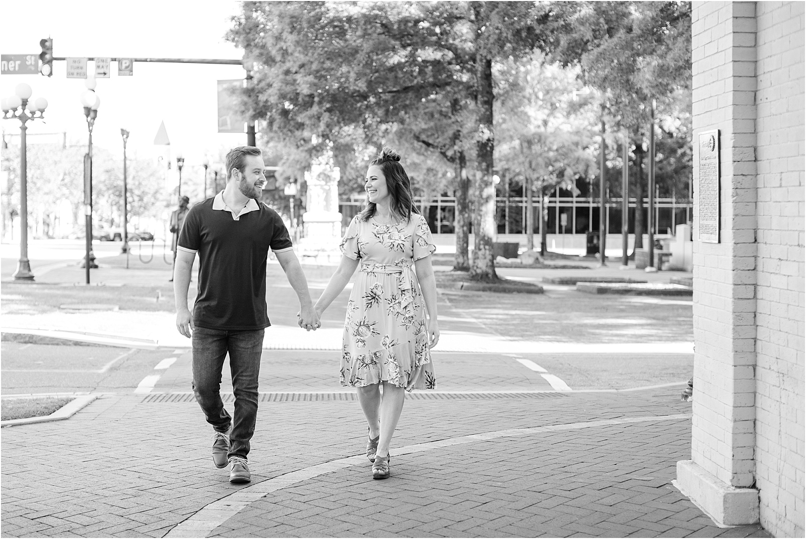 Anderosn SC couple walking in downtown holding hands
