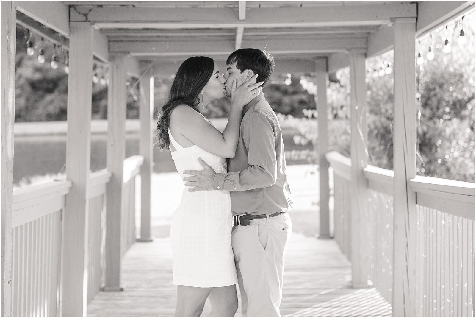 Couple kissing on a bridge