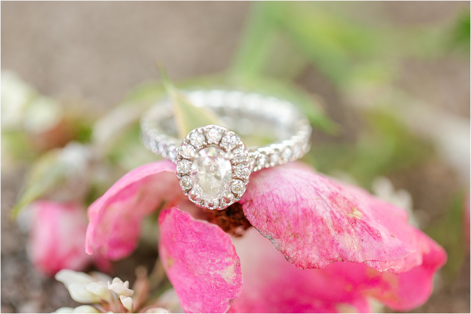 Large diamond white engagement ring on a flower