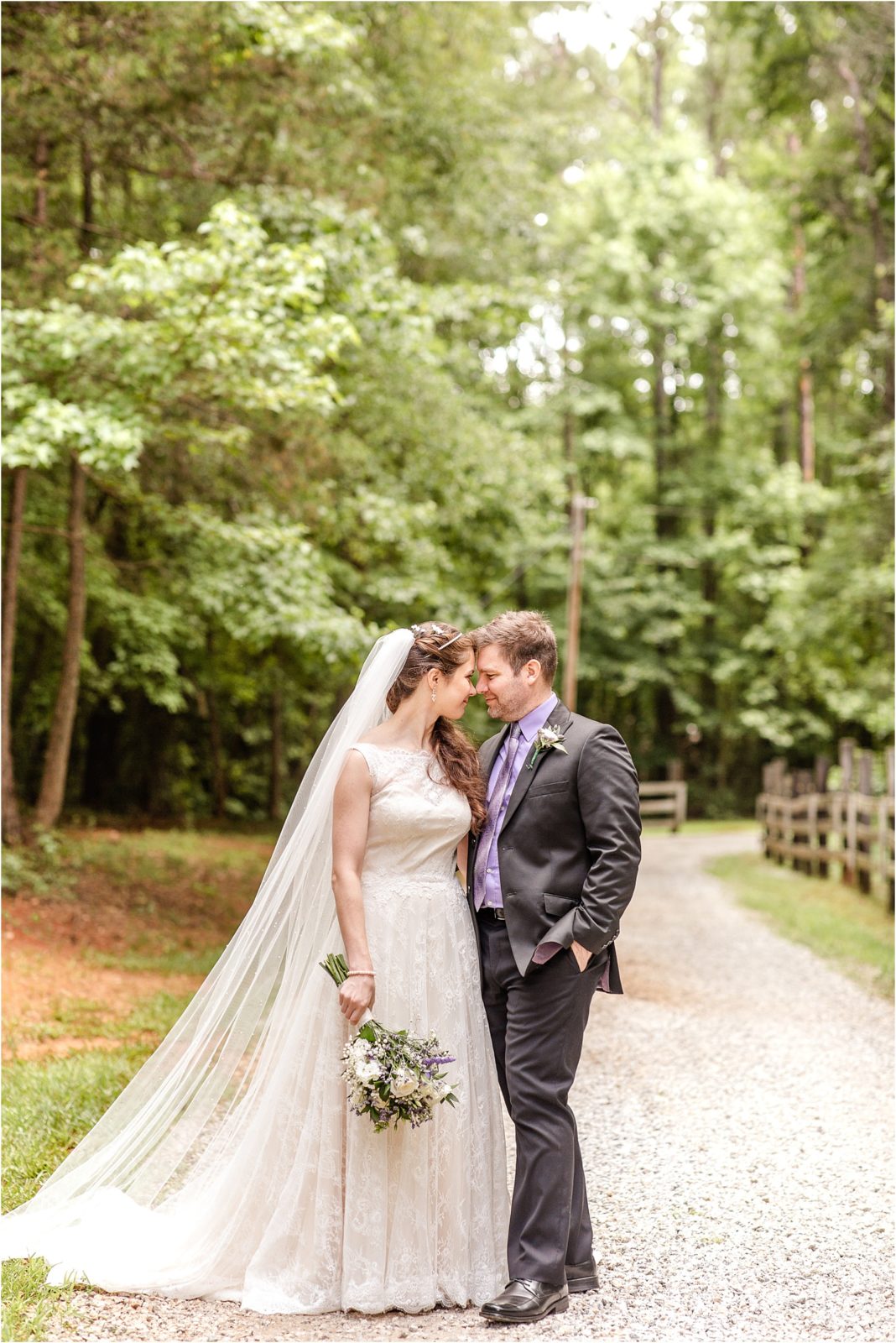 Wedding couple posing in woods