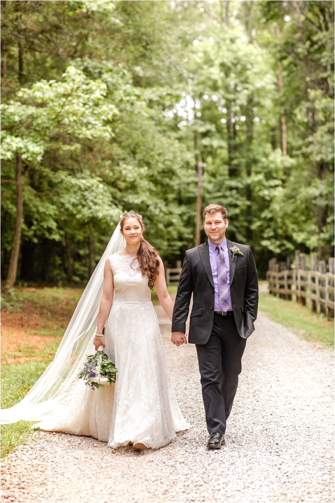 Wedding couple walking down gravel path