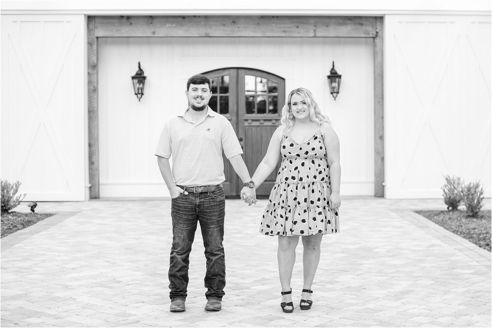Couple holding hands in front of wedding venue