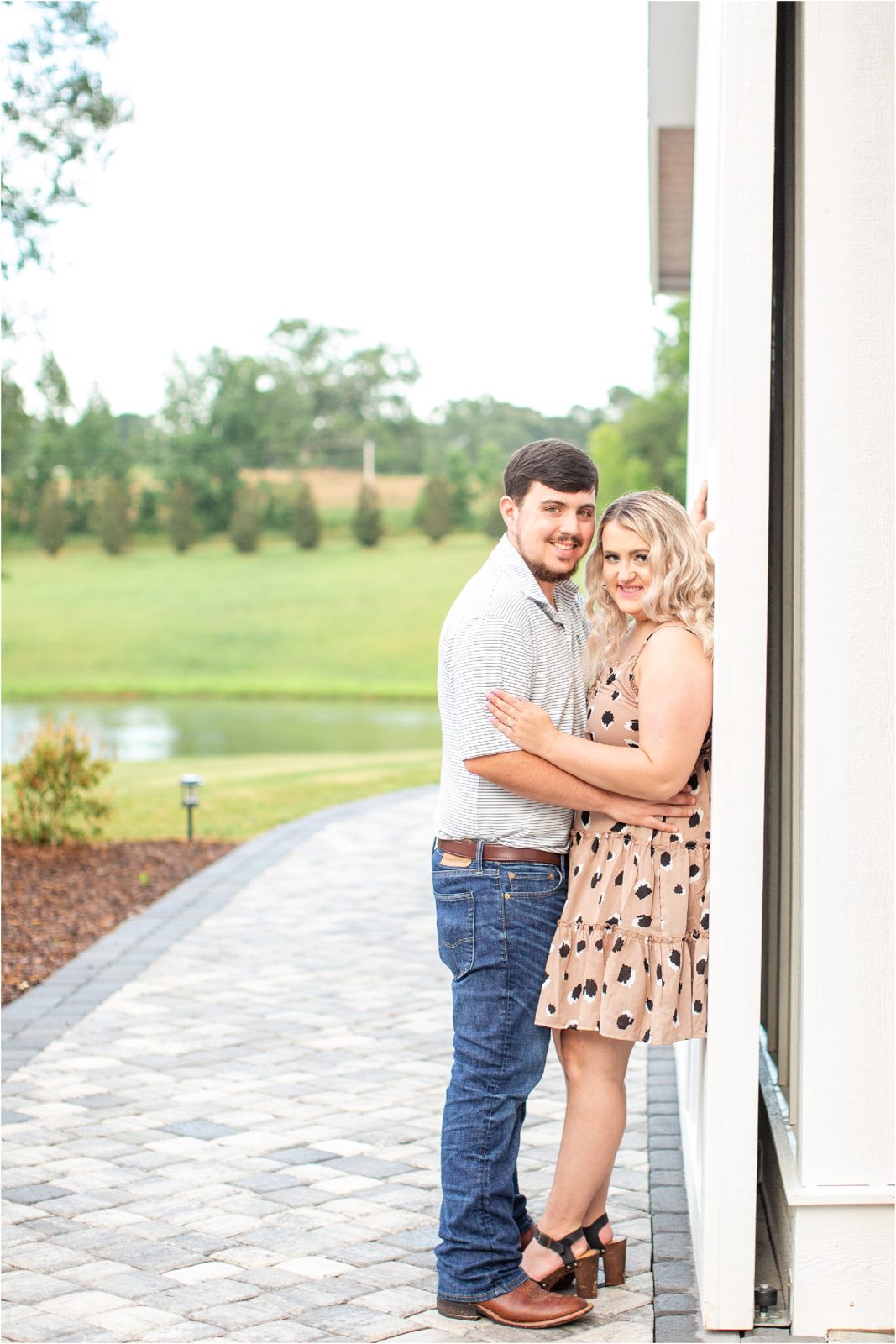 Woman leaning up against barn in Iva SC for engagement session