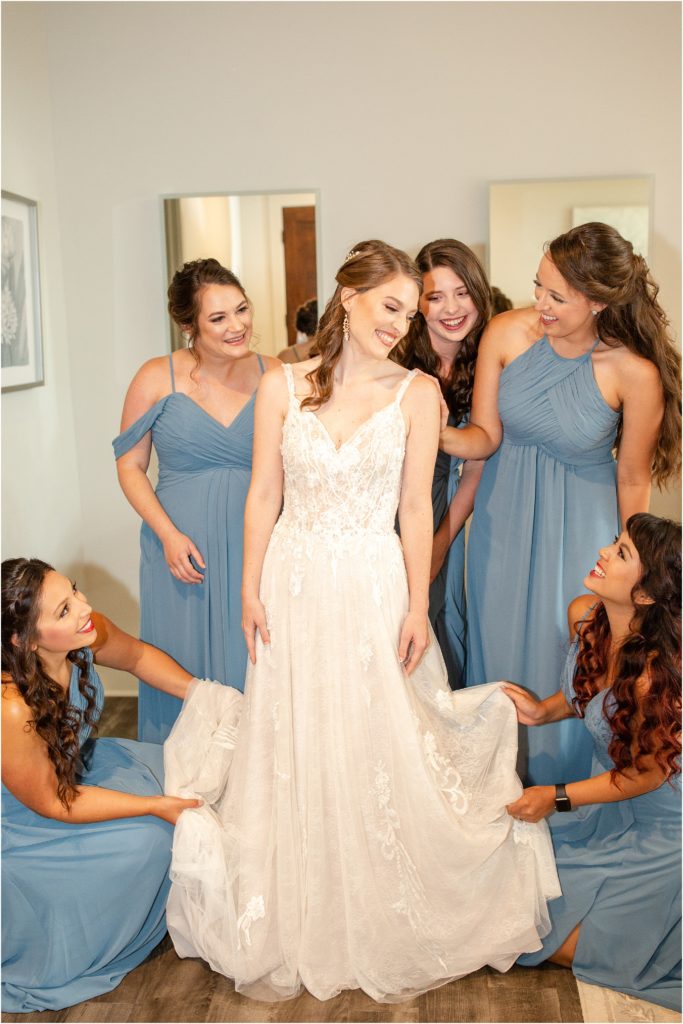 Women helping wedding dress
