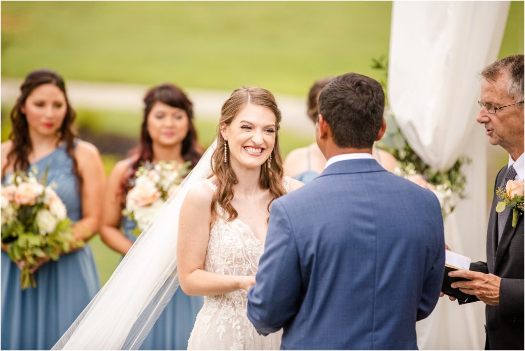 Bride smiles during wedding