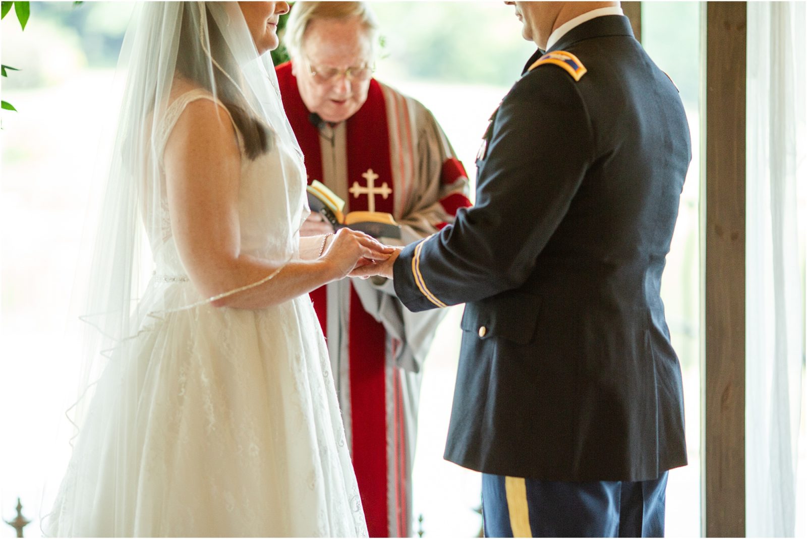 bride puts wedding ring on groom