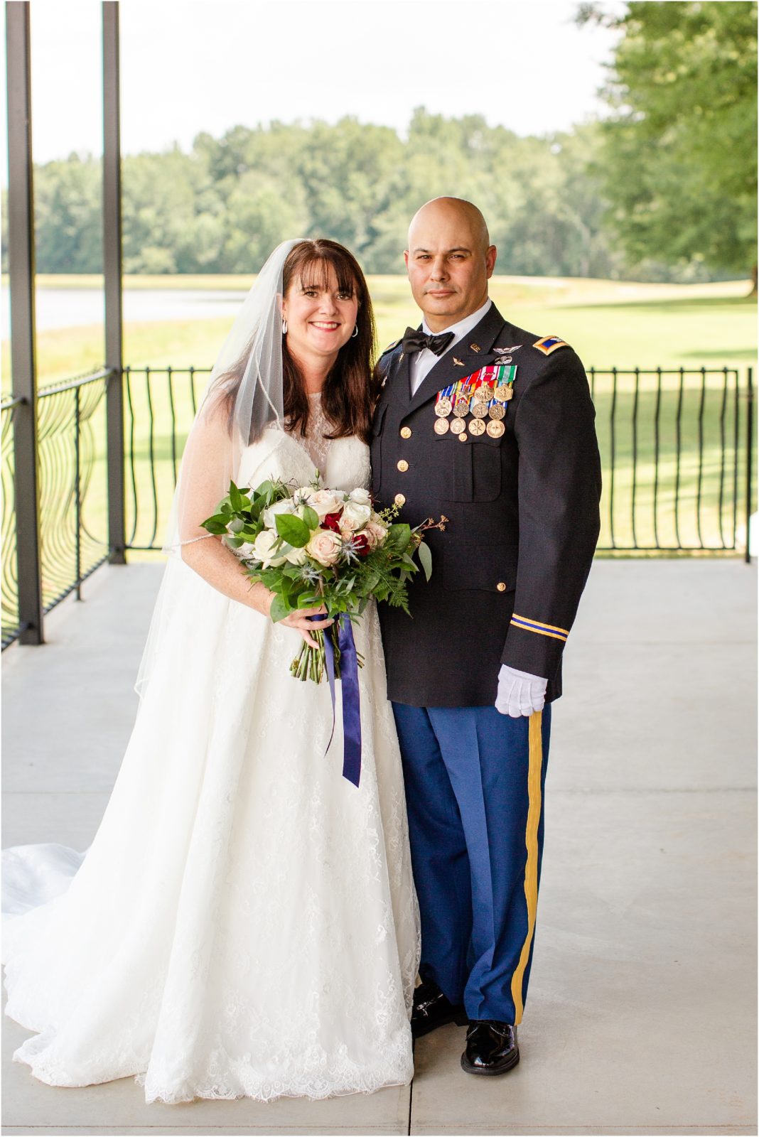 Military wedding couple posing for pictures