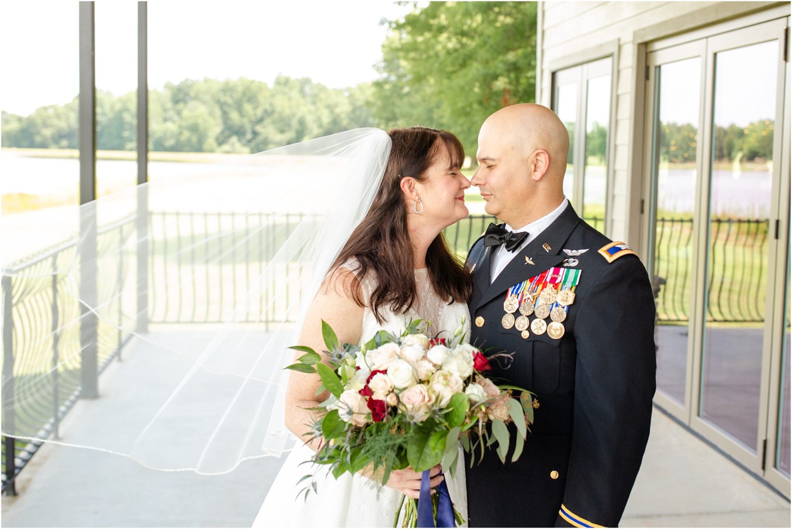 Military couple posing for wedding pictures