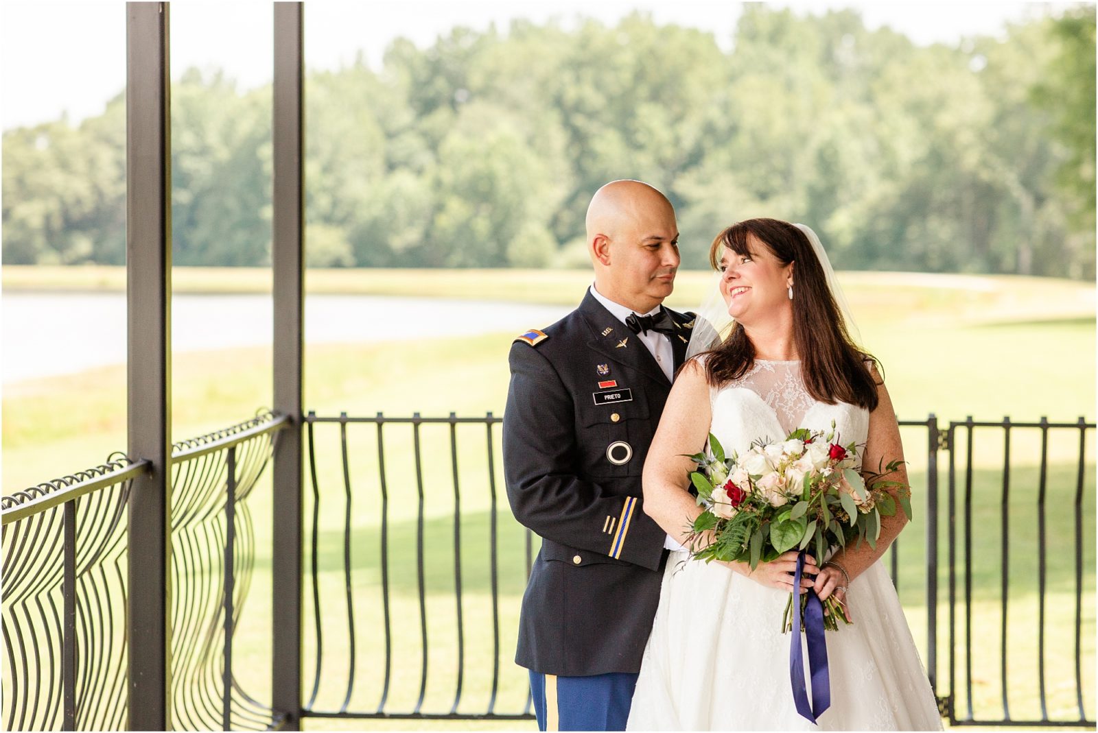 Military couple posing for wedding pictures