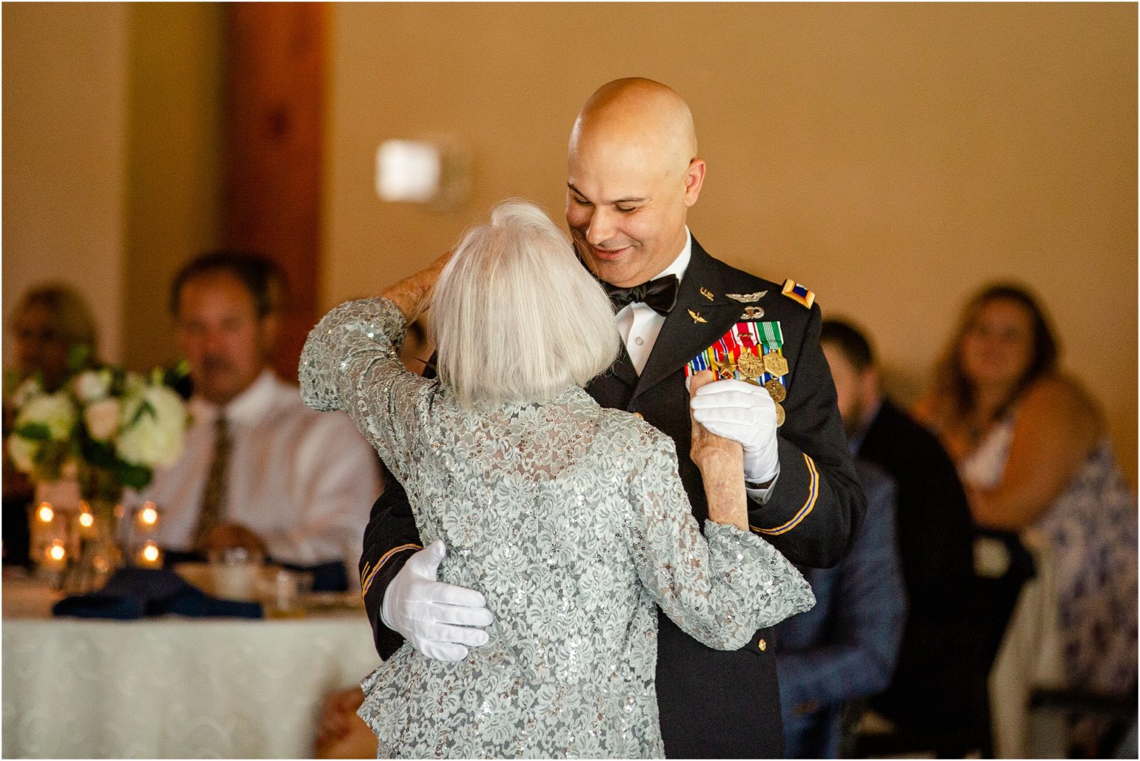 Navy groom dancing with mom