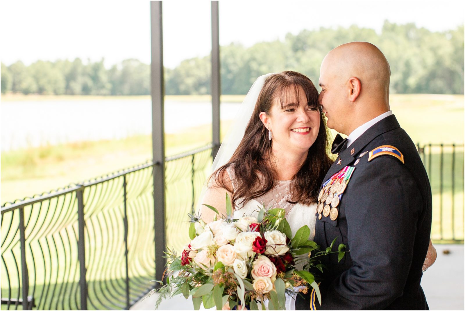 Military groom kissing bride