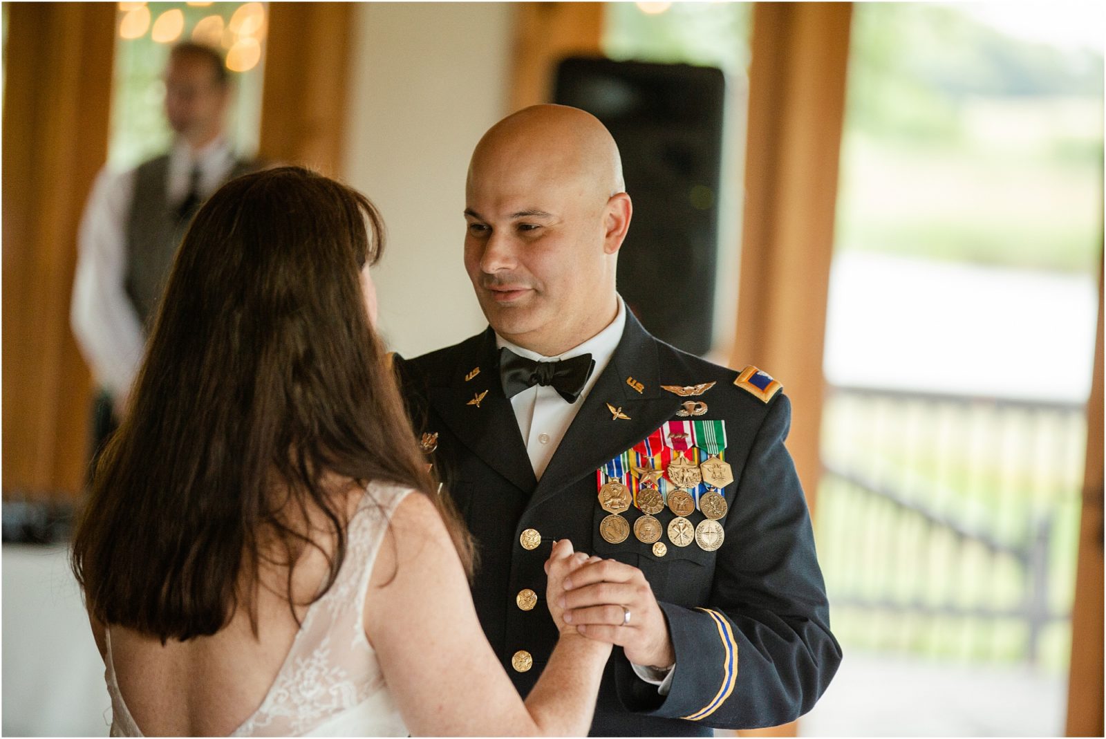 Military husband dancing with bride