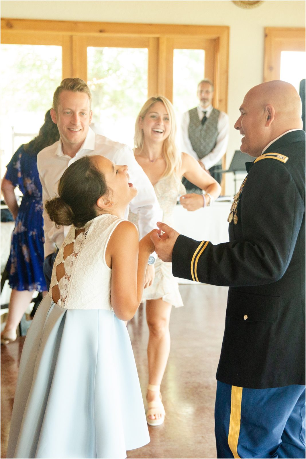 Military dad dancing with daughter