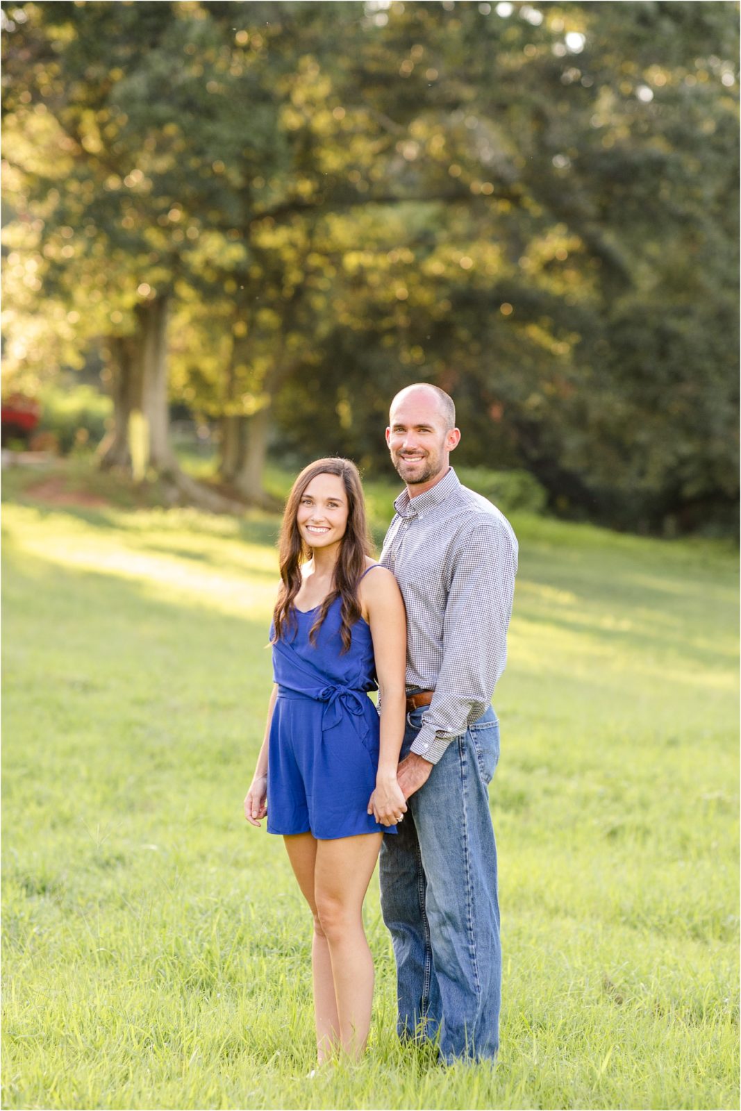 Engaged couple taking engagement pictures at Walker Century Farm