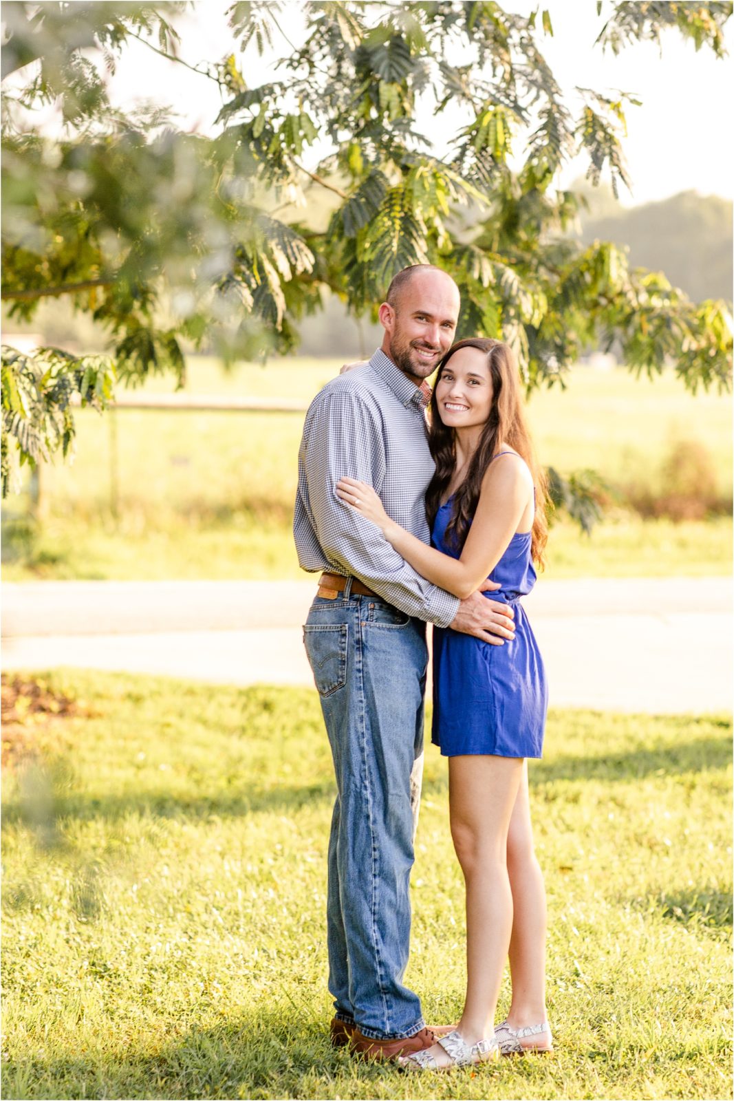 Anderson SC engaged couple in a field