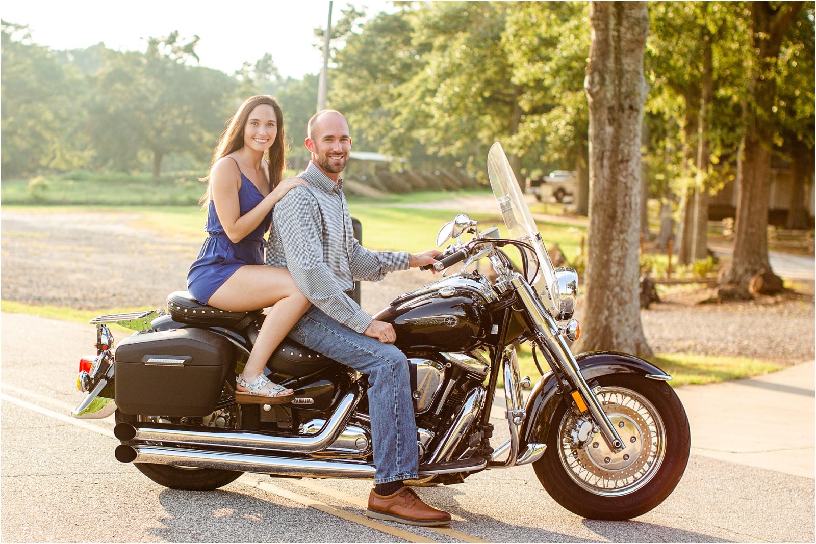 Happy couple riding on motorcycle for engagement session