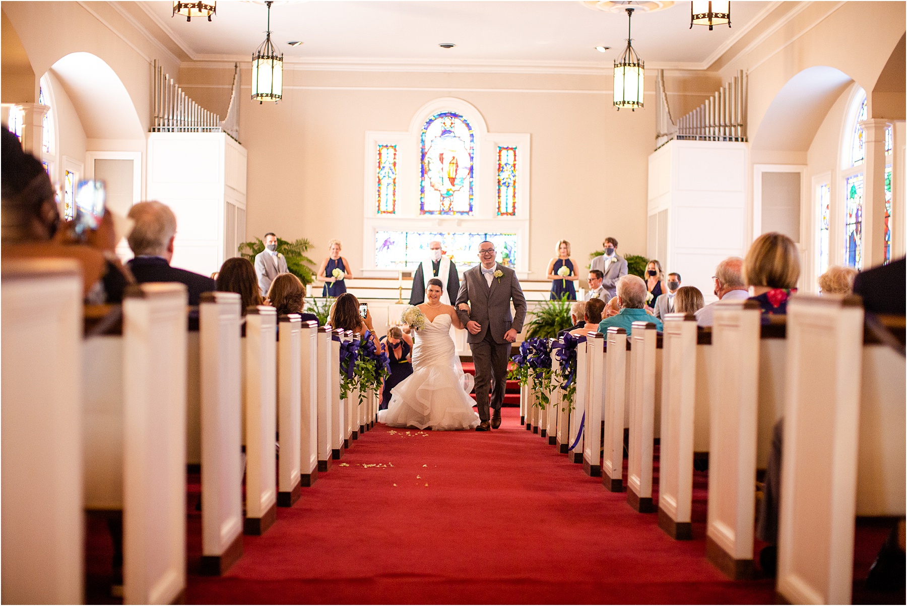 Couple walks down aisle after ceremony