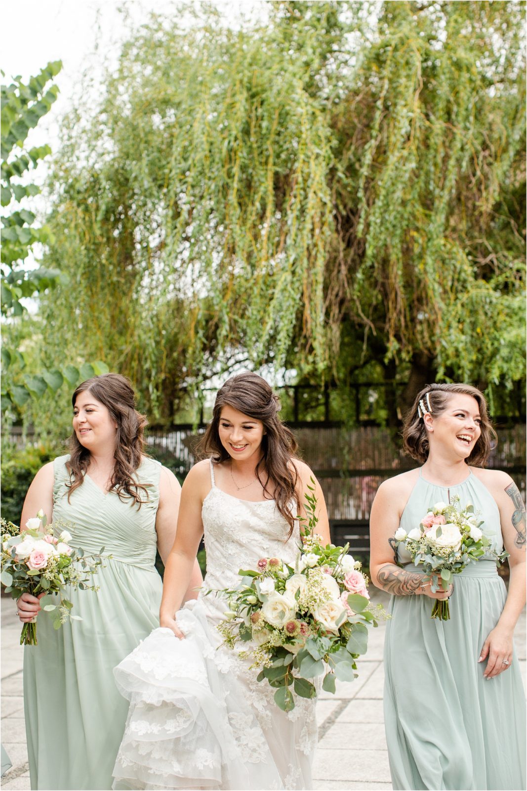 Women in wedding clothes walk with flowers