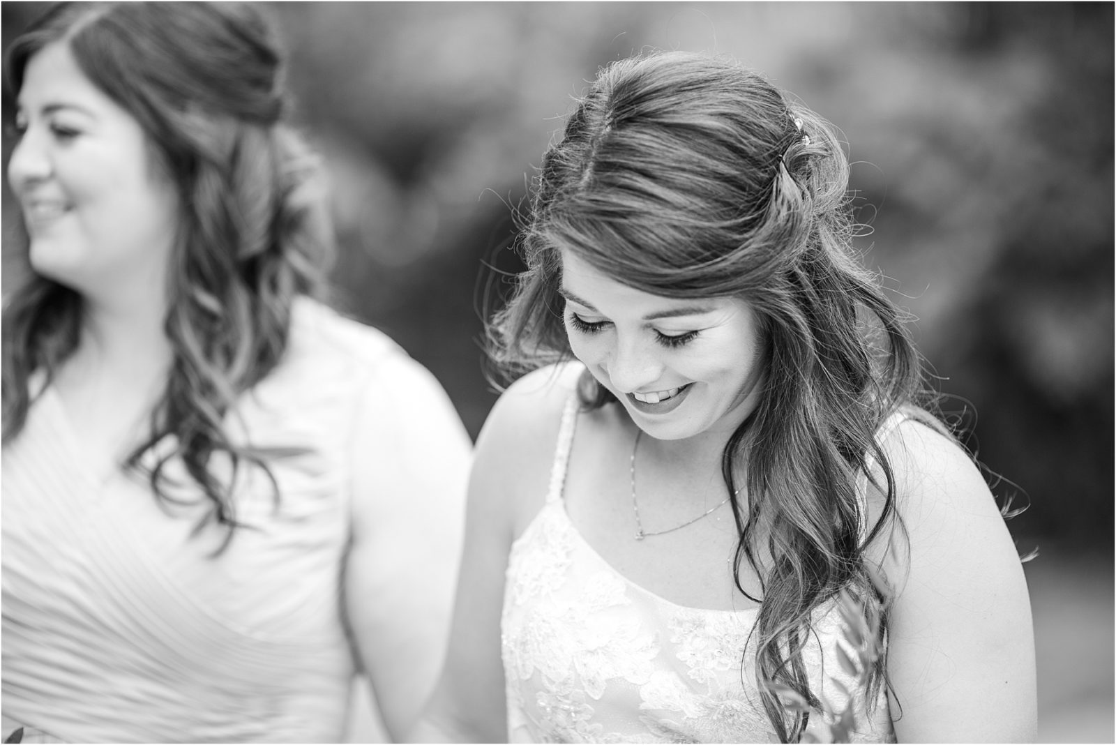 Bride looks at the ground while walking