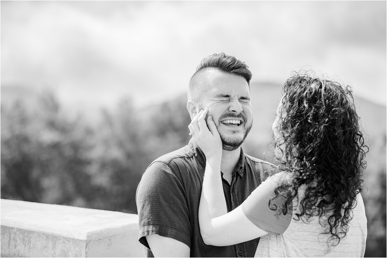 Man laughs after proposing to woman