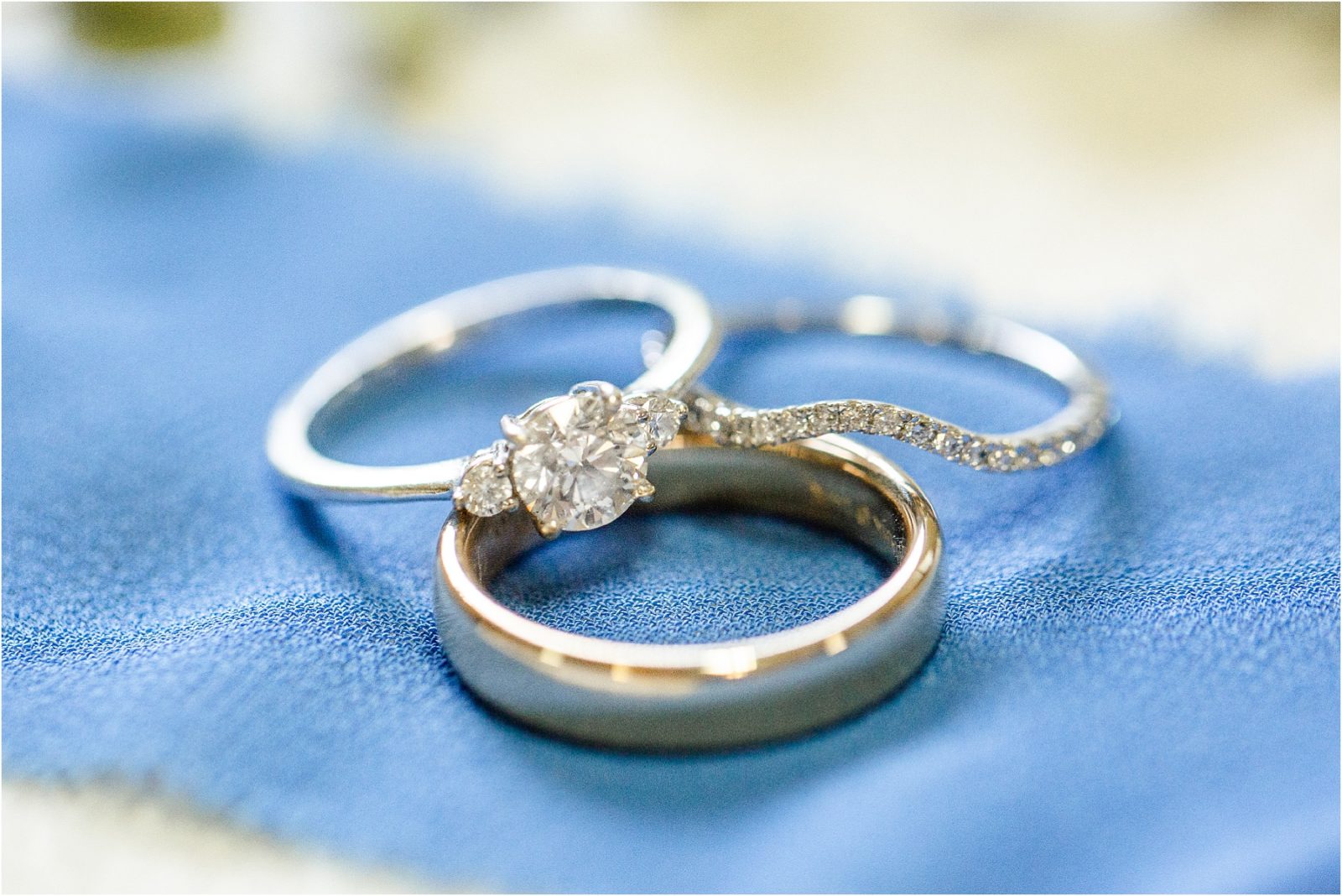 Wedding rings on blue ribbon