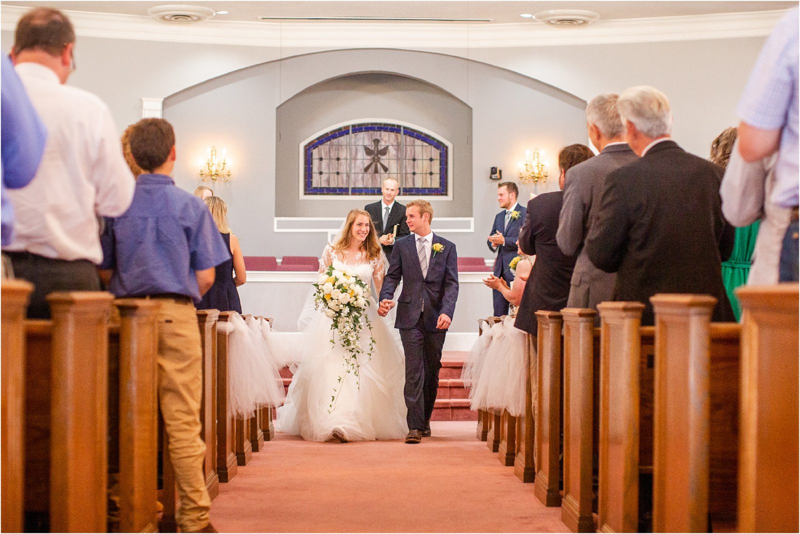 Georgia couple walking down church aisle after getting married
