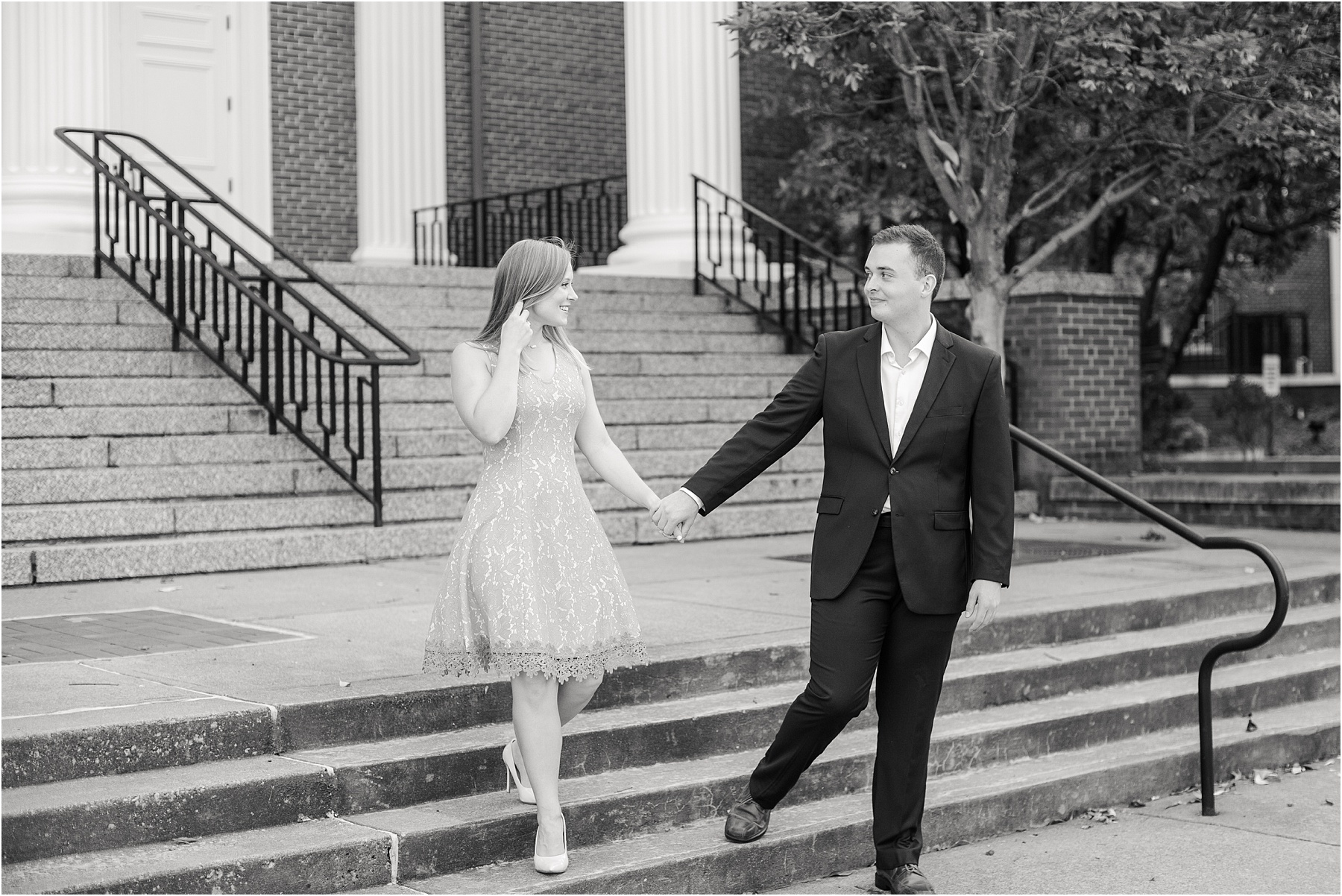 Engaged couple walking down Kentucky church steps