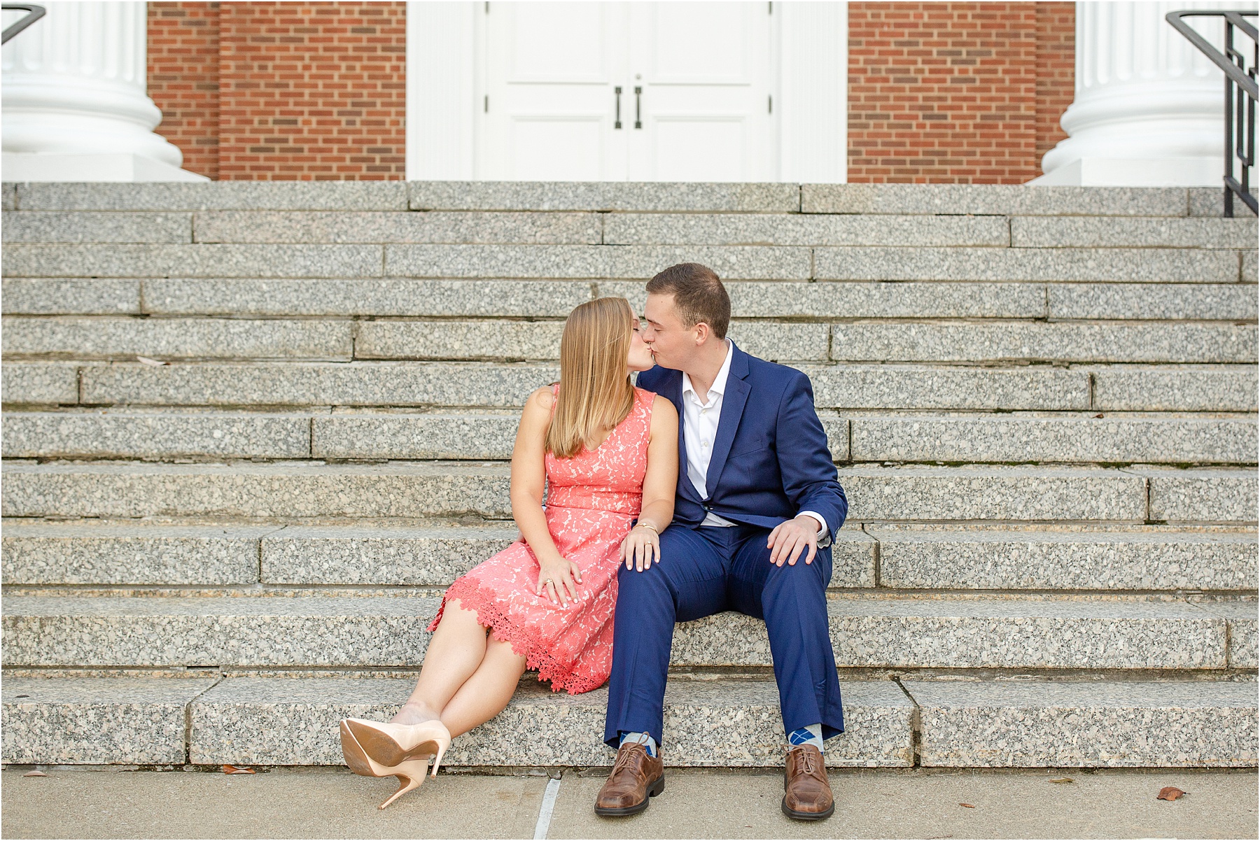 Engaged couple kissing on Kentucky church steps