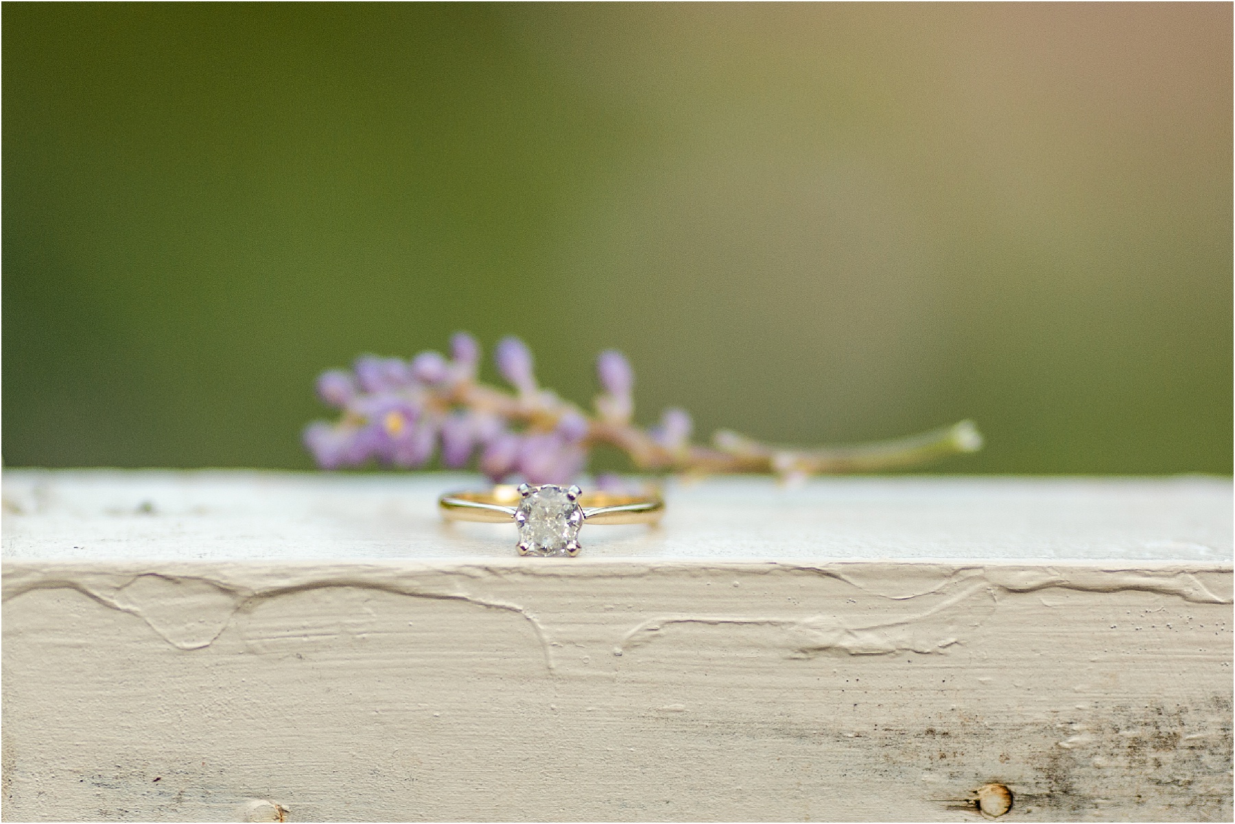 Diamond engagement ring on wooden post