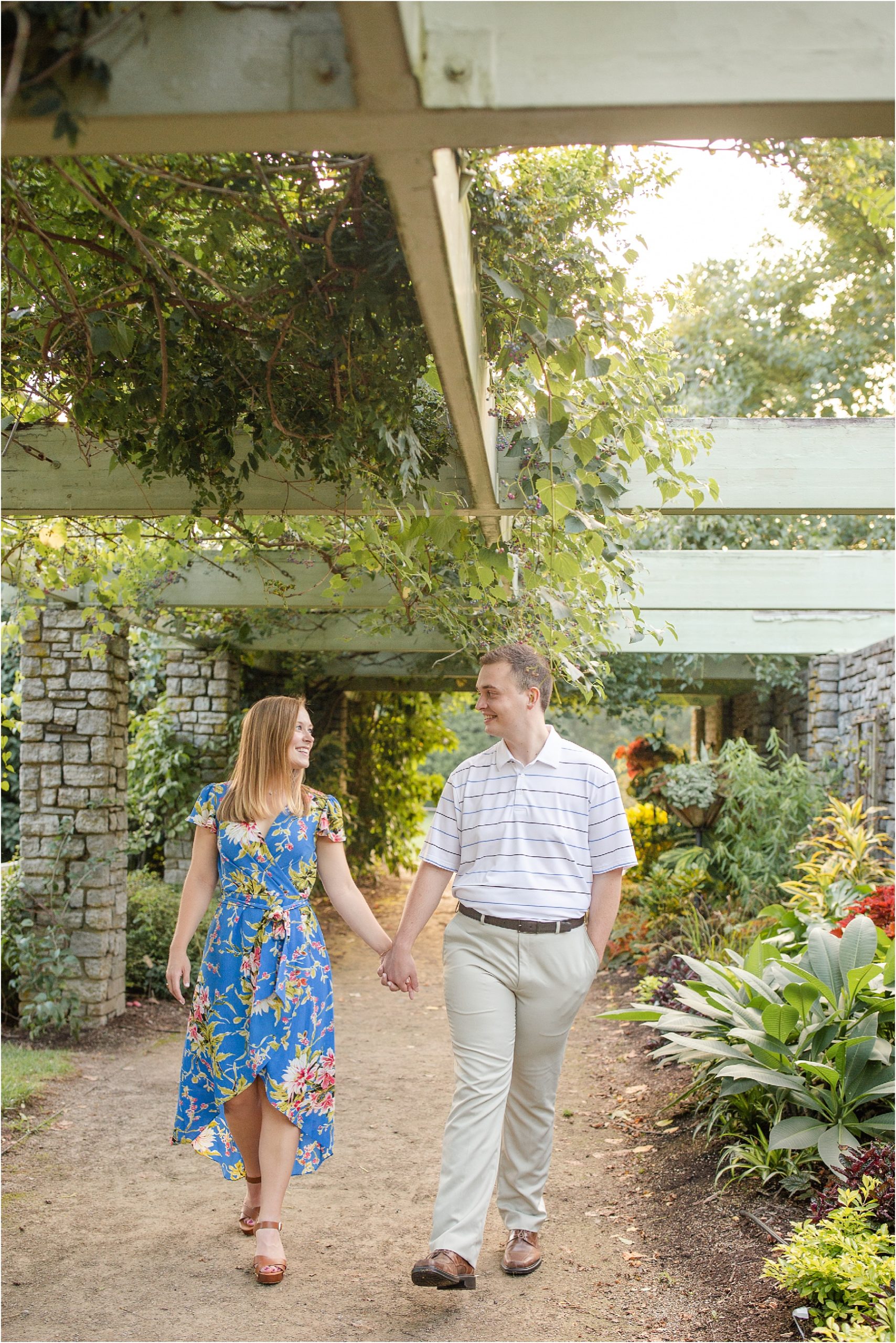 Couple holding hands in garden in Kentucky