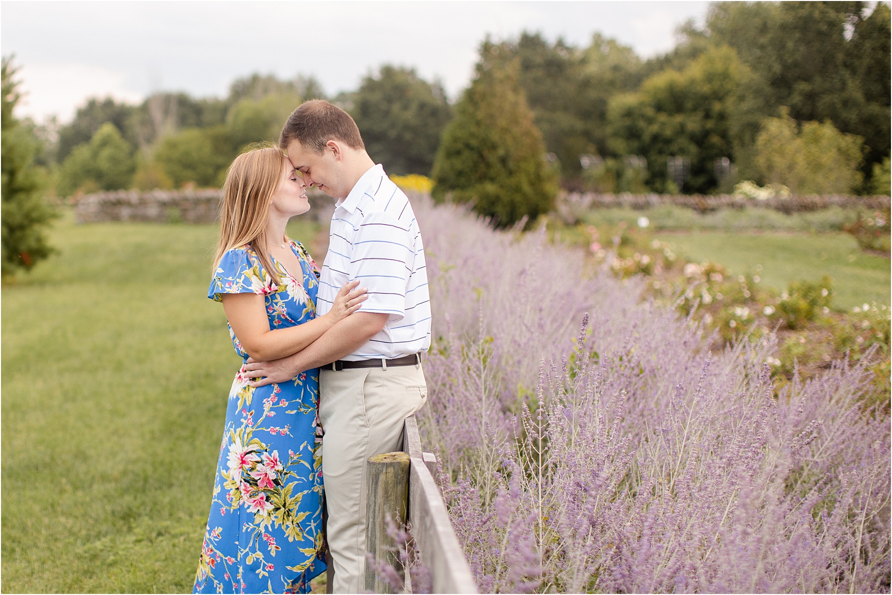 woman and man hug next to lavender field in Kentucky