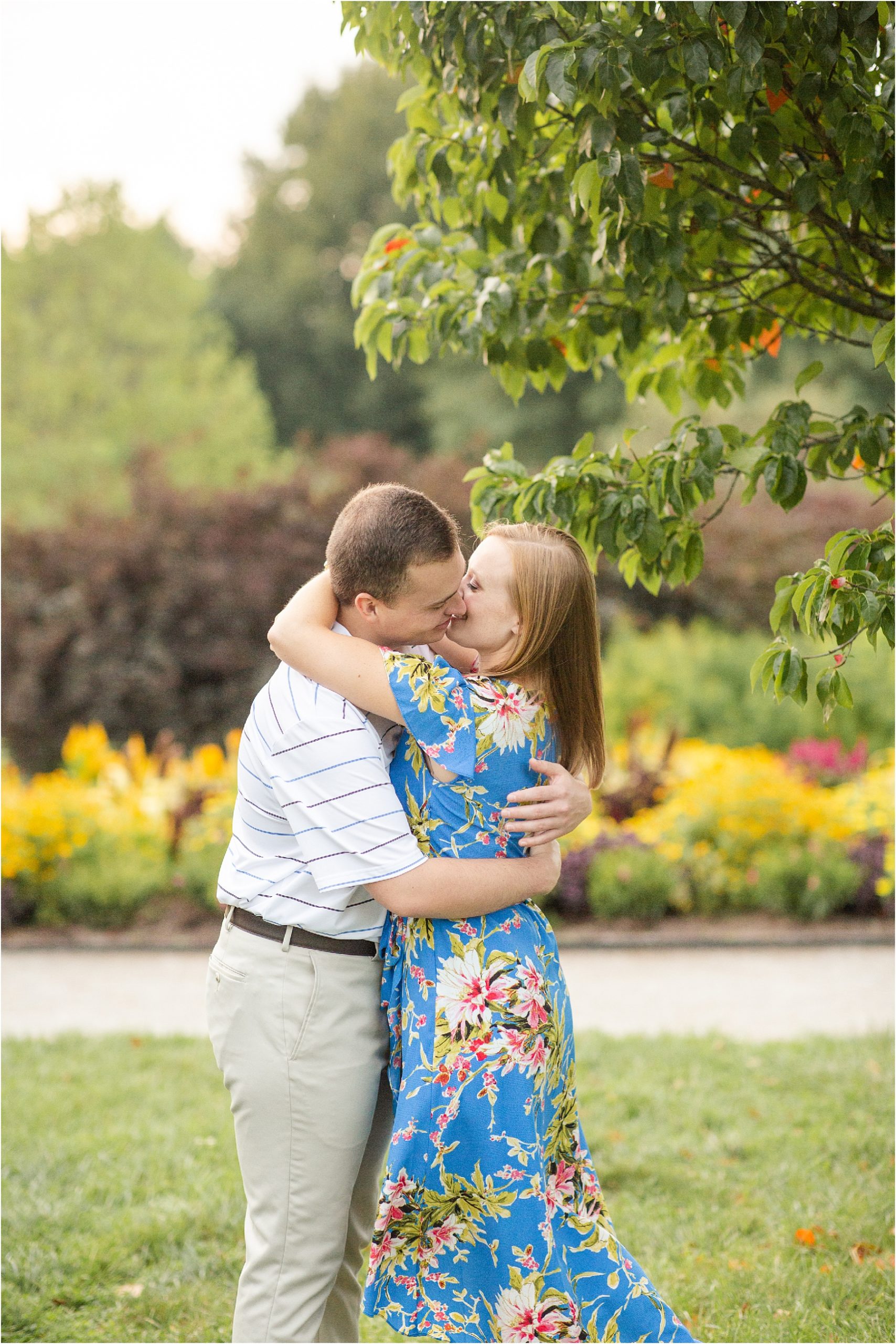 Kentucky engaged couple kissing in garden