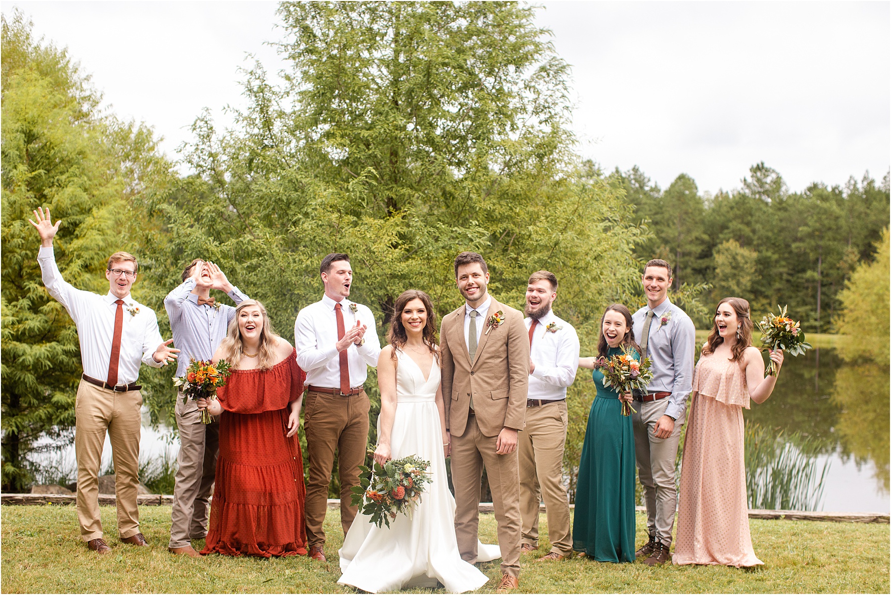 Wedding bridal party has fun celebrating with groom and bride