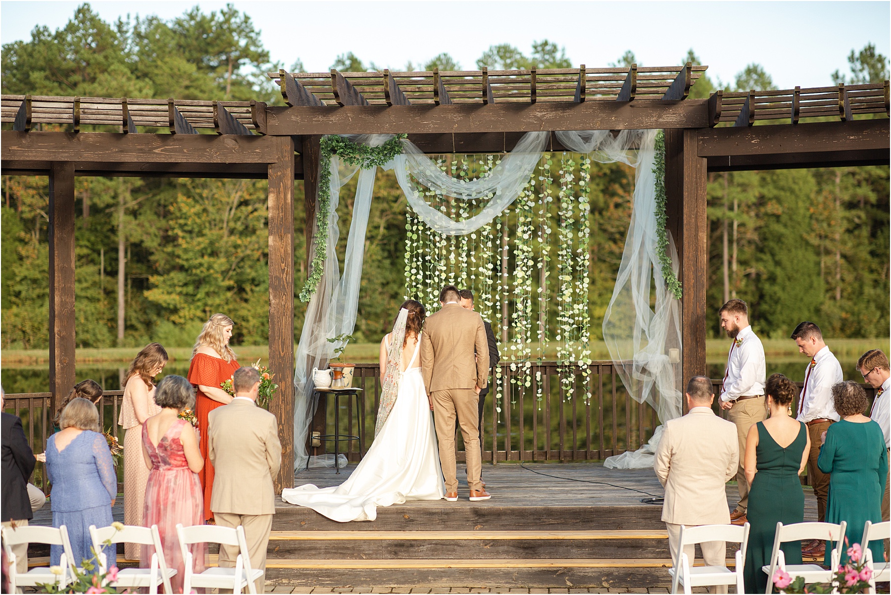 Couple getting married in front of a pond in Greenville South Carolina