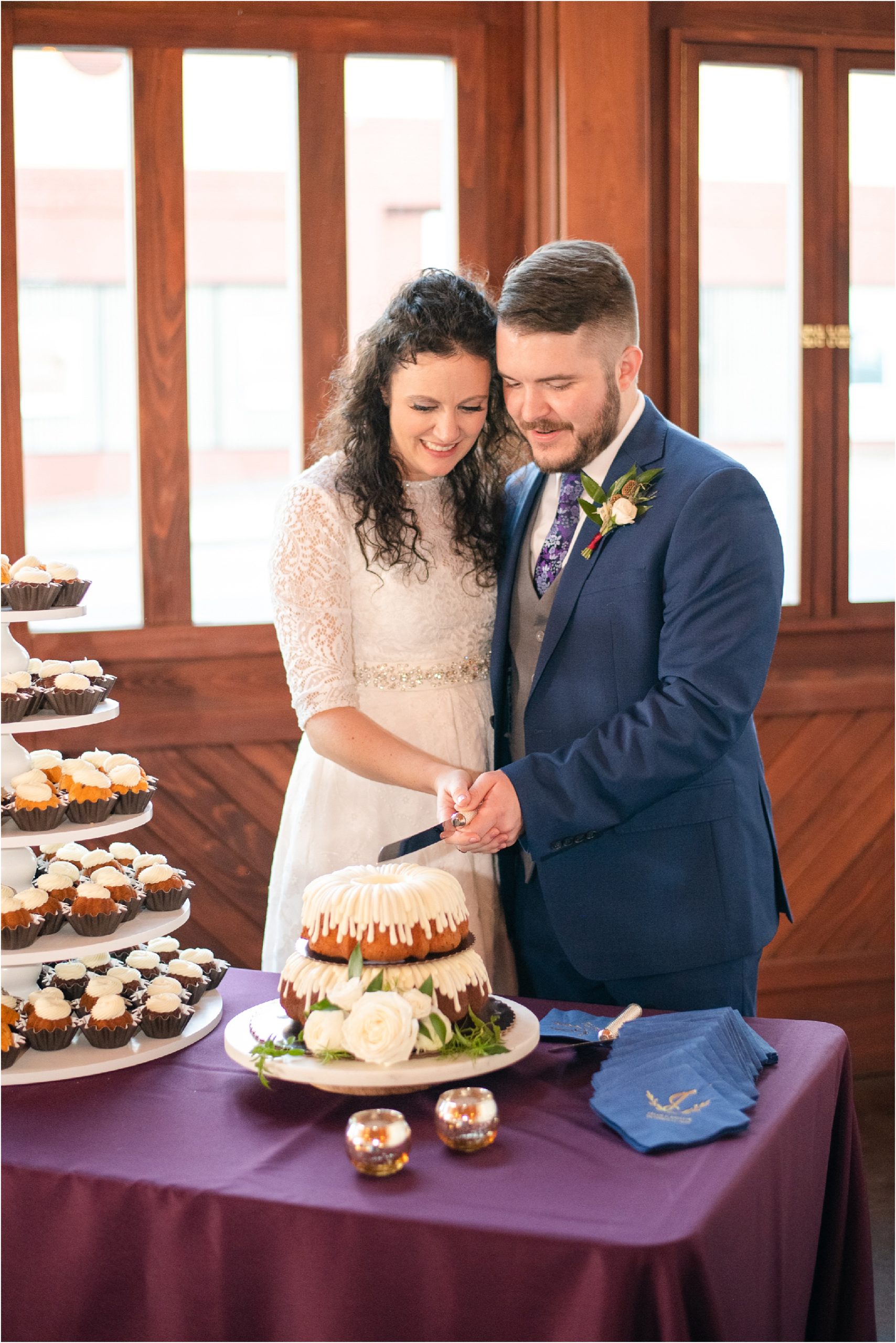 married couple cutting wedding bundt cake