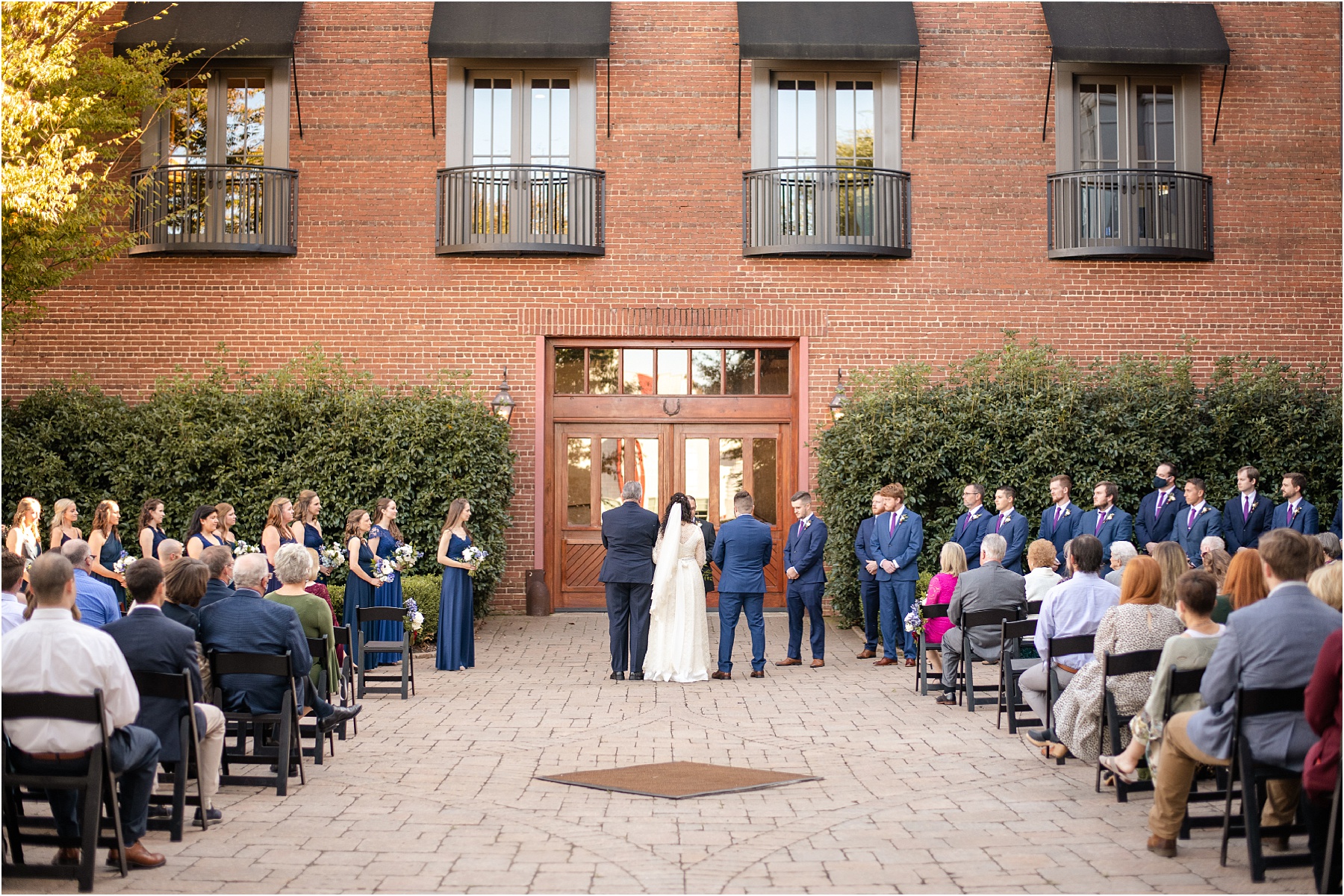 Wide shot of Bleckley Inn courtyard with wedding