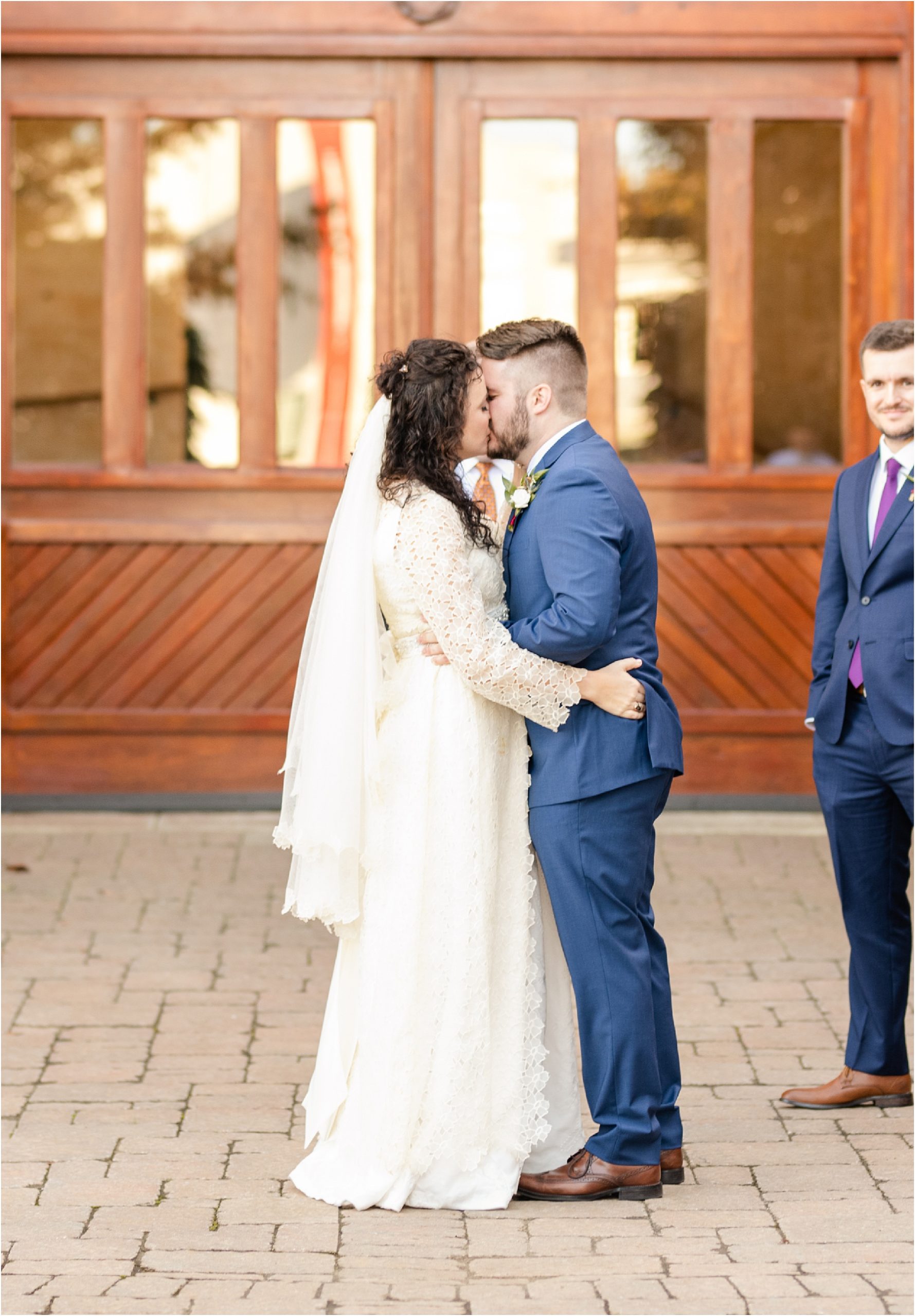 Bride and groom share first kiss outside Bleckley Inn