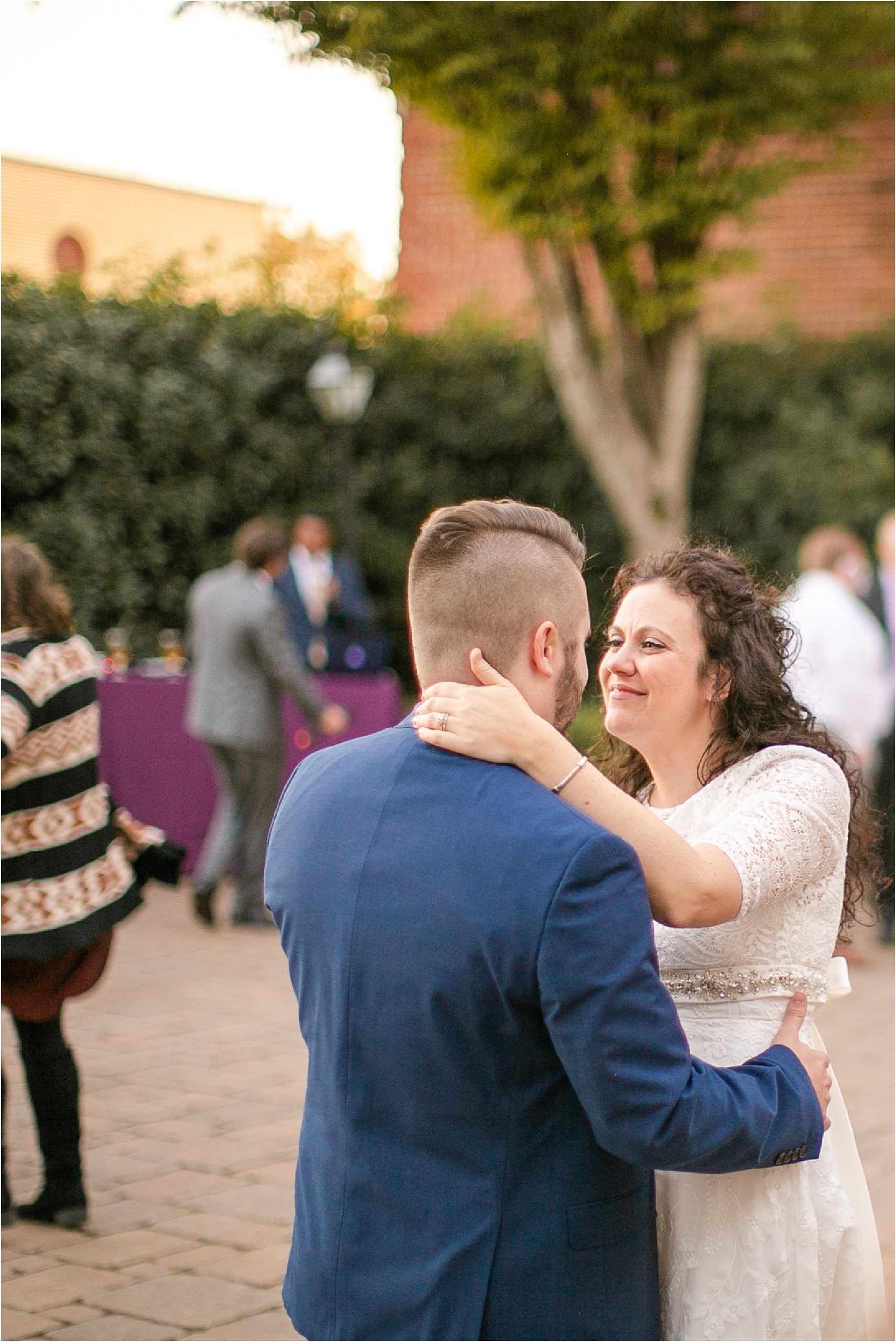 Groom dancing with his bride outside of Bleckley wedding