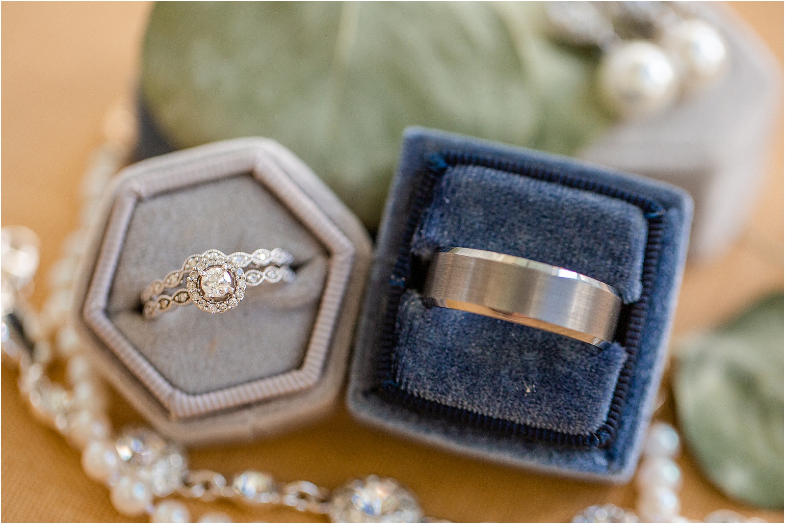 set of wedding bands in ring boxes